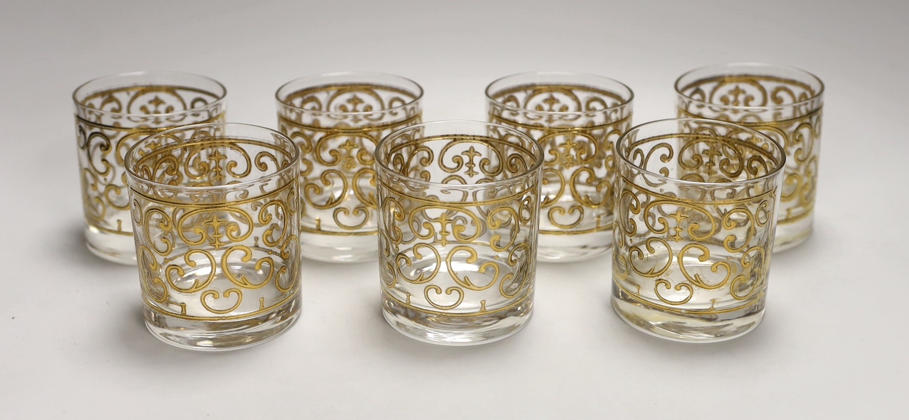 A set of seven Georges Briard gilded glass tumblers